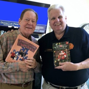 Santa Tim Cavendar and David Ginn, holding their books